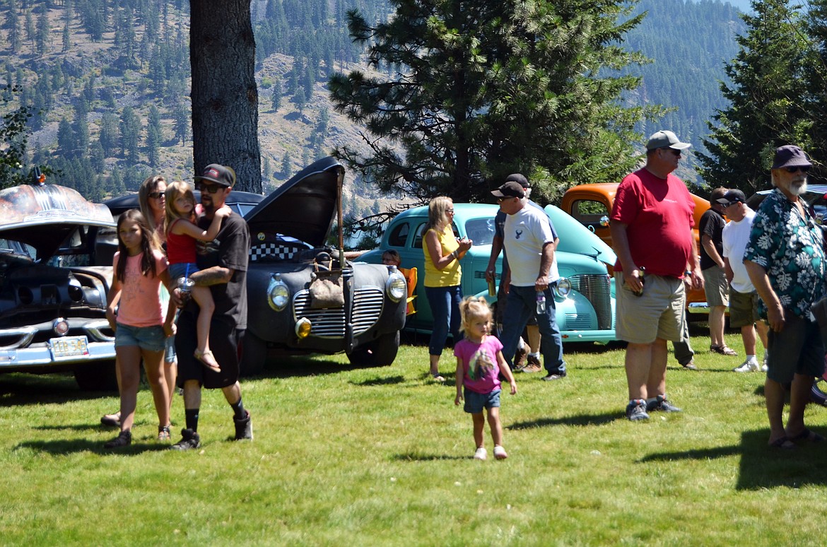 Crowds enjoyed walking through the many cars on show as they sat along the waters edge (Erin Jusseaume/ Clark Fork Valley Press)