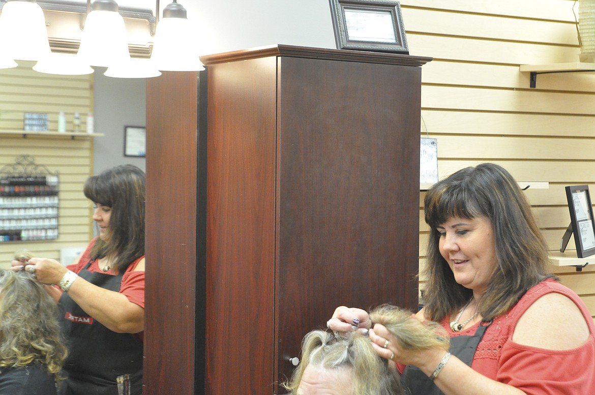 A NARCOTICS detective with the Lake County Sheriff&#146;s Office has been reassigned, and Lisha Fitzpatrick at Main Idea Salon in Polson cut his long locks. (Ashley Fox/Lake County Leader)