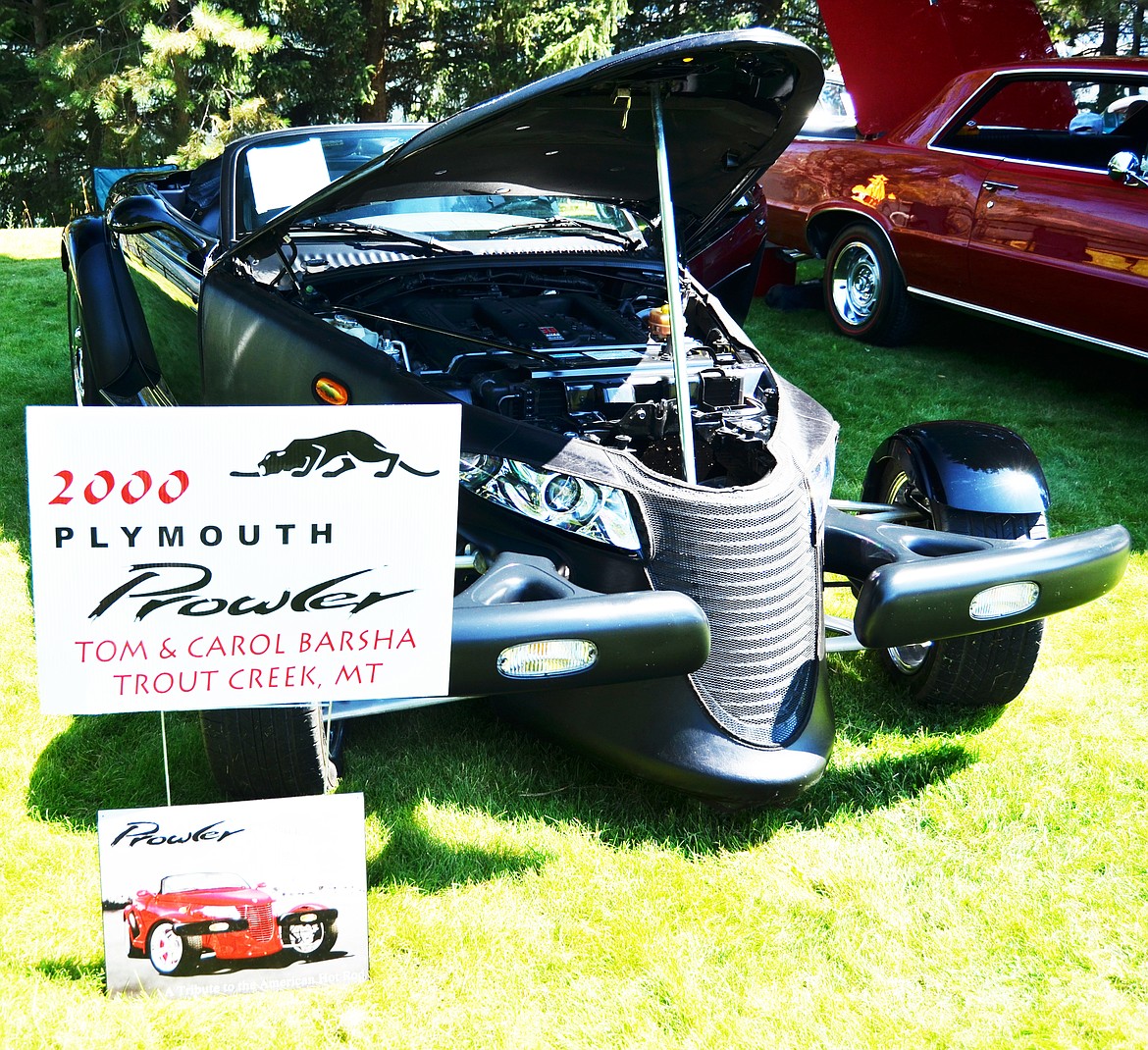 Plenty of attendees took the opportunity to grab a photo in this 200 Plymouth Prowler owned by Trout Creek locals Tom and Carol Barsha (Erin Jusseaume/ Clark Fork Valley Press)