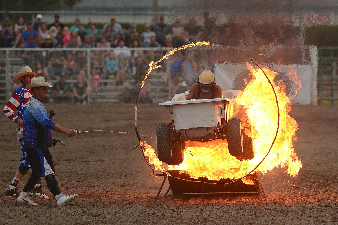 Denny The Rodeo Clown rides a motorized bathtub on wheels through a ring of fire during an intermission at the Northwest Montana Fair PRCA Rodeo on Friday evening at the Flathead County Fairgrounds. (Casey Kreider/Daily Inter Lake)