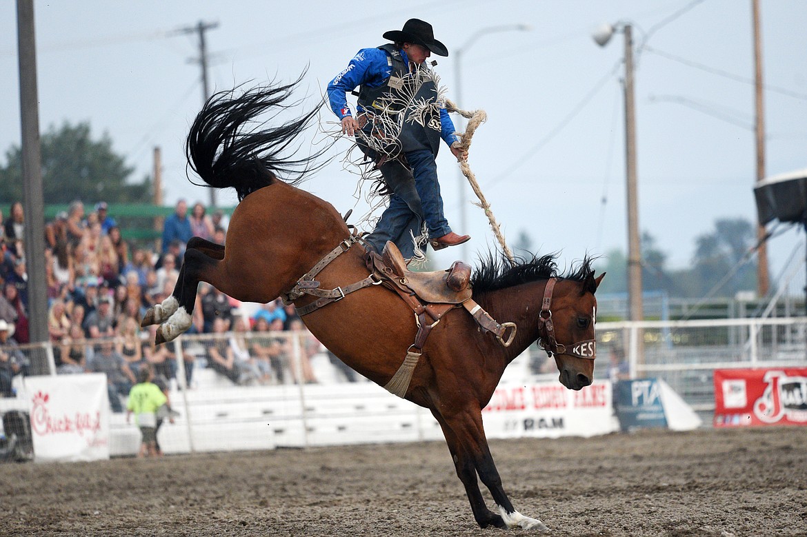 Rusty Wright, of Milford, UT, is bucked off his horse Believe Me during the Saddle Bronc Riding event at the Northwest Montana Fair and Rodeo on Thursday. (Casey Kreider/Daily Inter Lake)