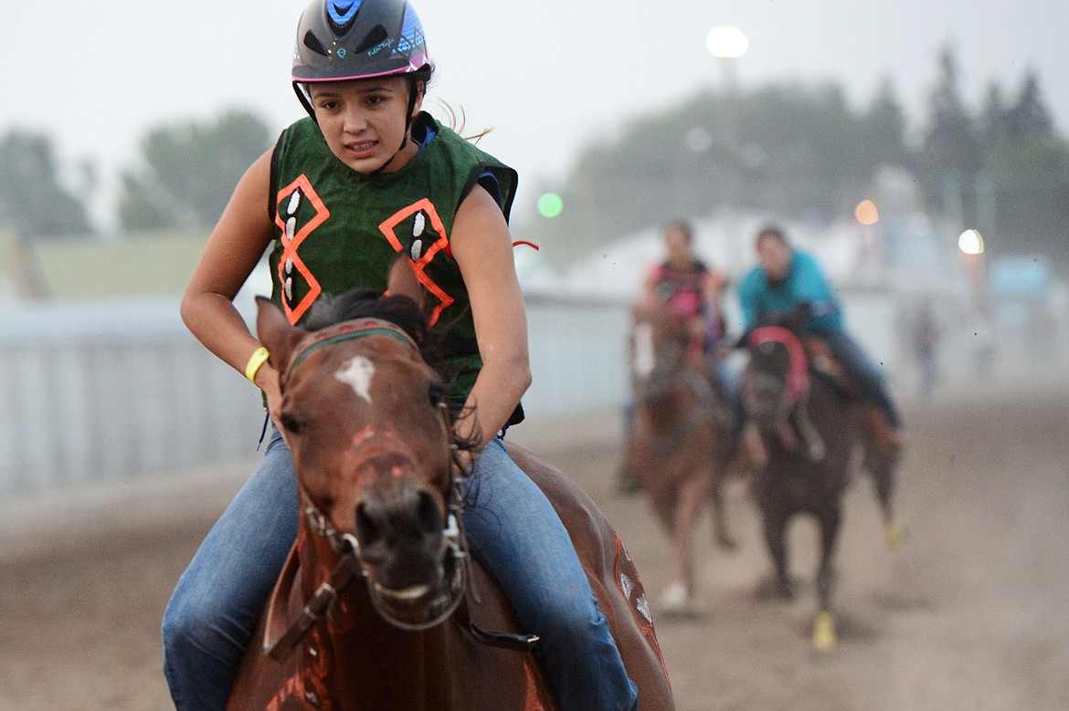 Chenoa Erickson, of Inchelium, Washington, races during the Indian Relay Races at the Northwest Montana Fair PRCA Rodeo on Saturday evening at the Flathead County Fairgrounds. (Casey Kreider/Daily Inter Lake)