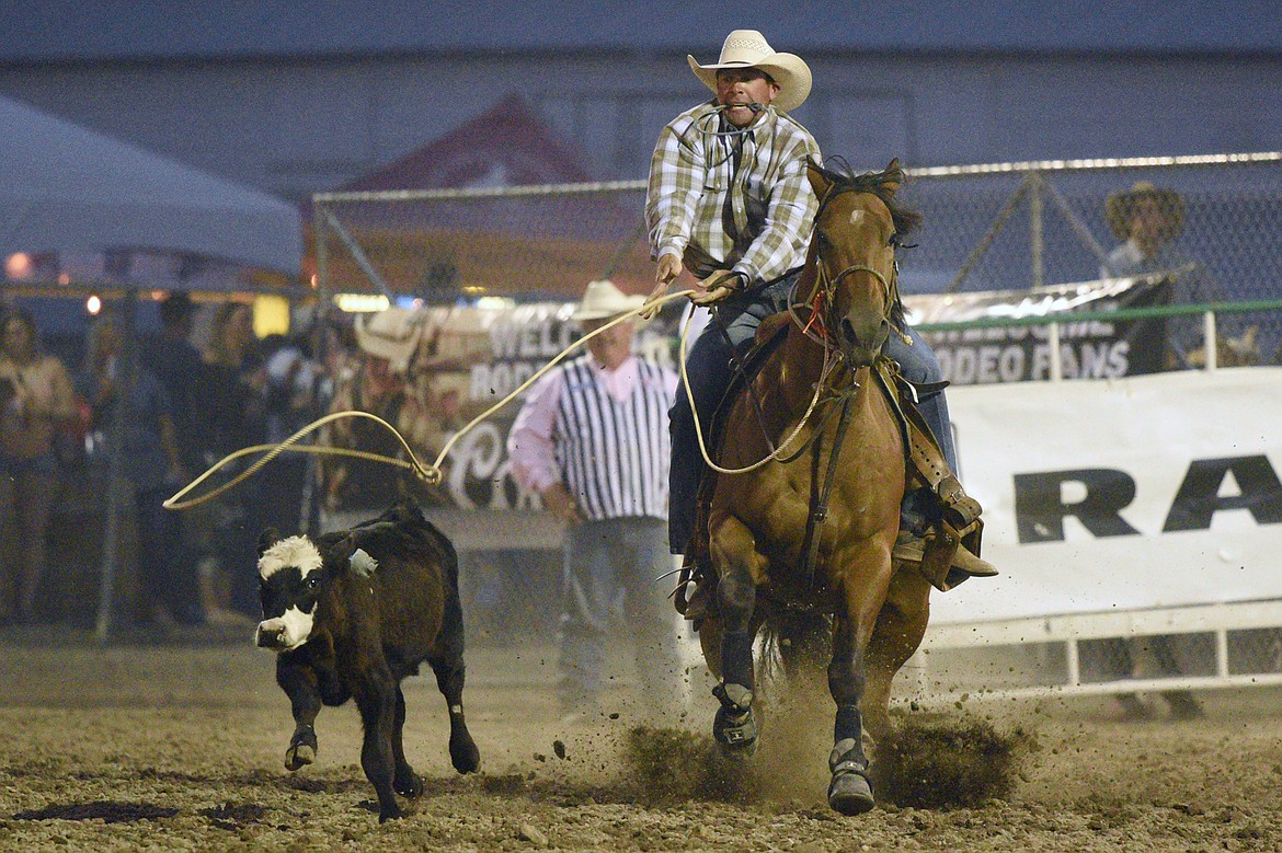 Sam Levine, of Wolf Creek, competes during the tie down roping event at the Northwest Montana Fair PRCA Rodeo on Saturday evening at the Flathead County Fairgrounds. (Casey Kreider/Daily Inter Lake)