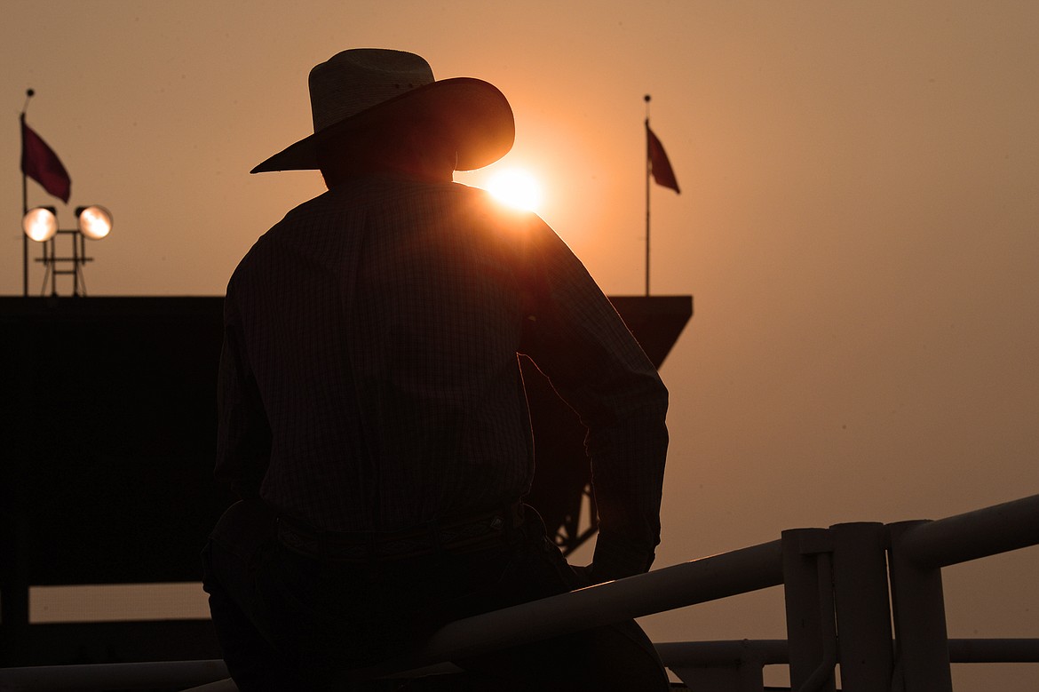 Wyatt Shriver, of Marion, watches the grand entry prior to the start of the rodeo at the Northwest Montana Fair and Rodeo on Thursday. (Casey Kreider/Daily Inter Lake)