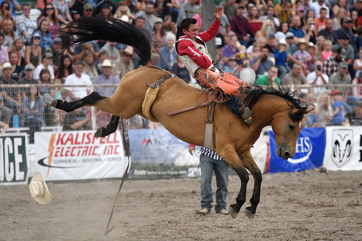 Clayton Bigelow, of Clements, CA, holds on to his horse Alley Street during the bareback riding event at the Northwest Montana Fair PRCA Rodeo on Friday evening at the Flathead County Fairgrounds. (Casey Kreider/Daily Inter Lake)