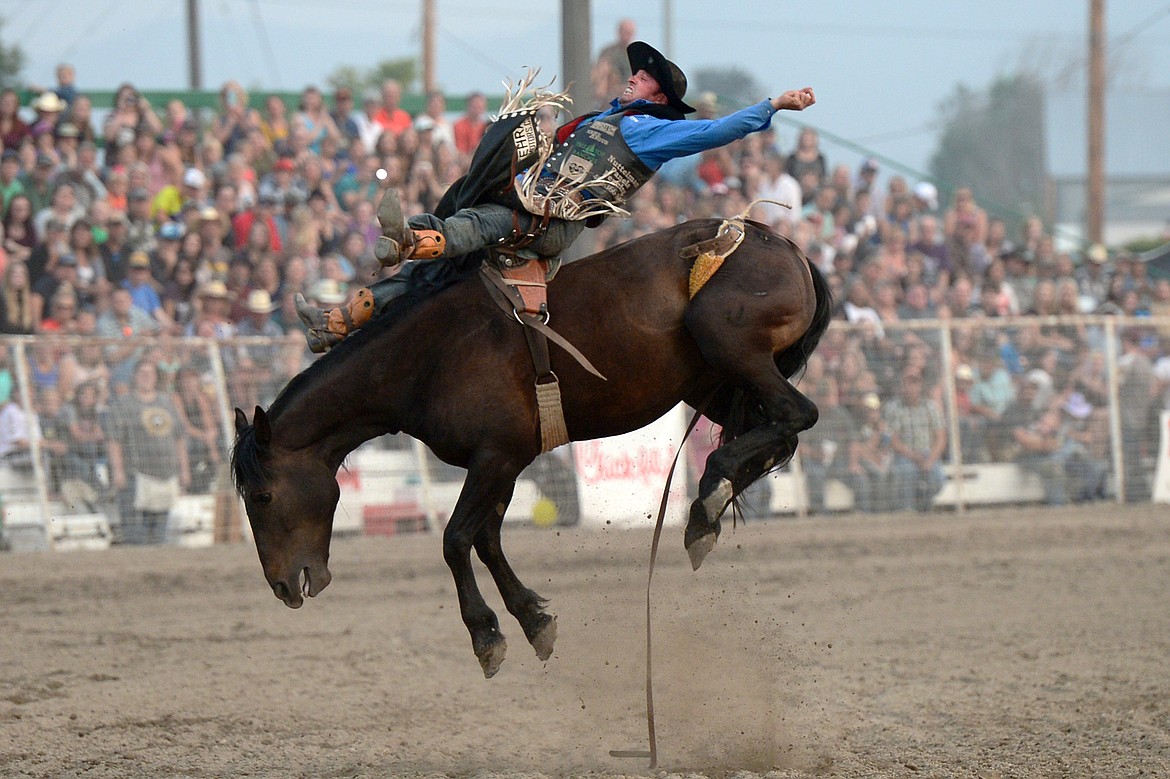 Steven Dent, of Mullen, Nebraska, holds on to his horse Mighty Fine during the bareback riding event at the Northwest Montana Fair PRCA Rodeo on Saturday evening at the Flathead County Fairgrounds. (Casey Kreider/Daily Inter Lake)