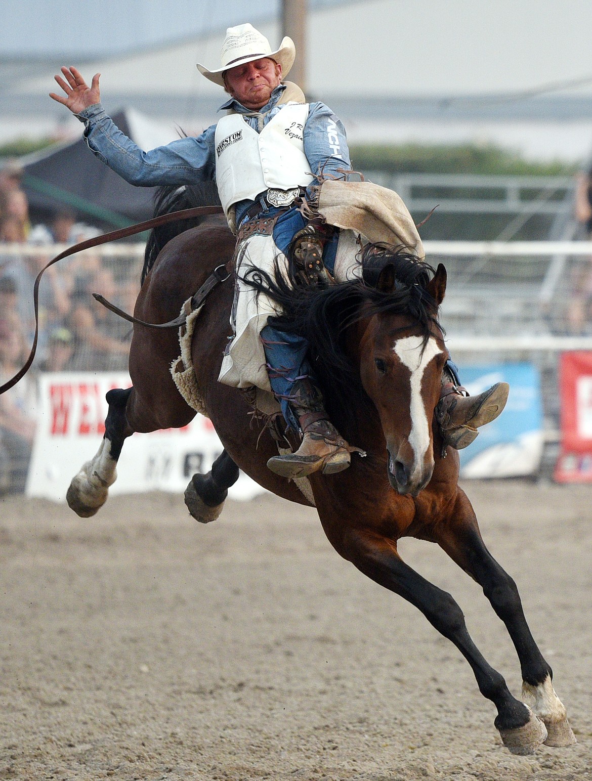 JR Vezain, of Cowley, Wyoming, holds on to his horse Make Believe during the bareback riding event at the Northwest Montana Fair PRCA Rodeo on Saturday evening at the Flathead County Fairgrounds. (Casey Kreider/Daily Inter Lake)