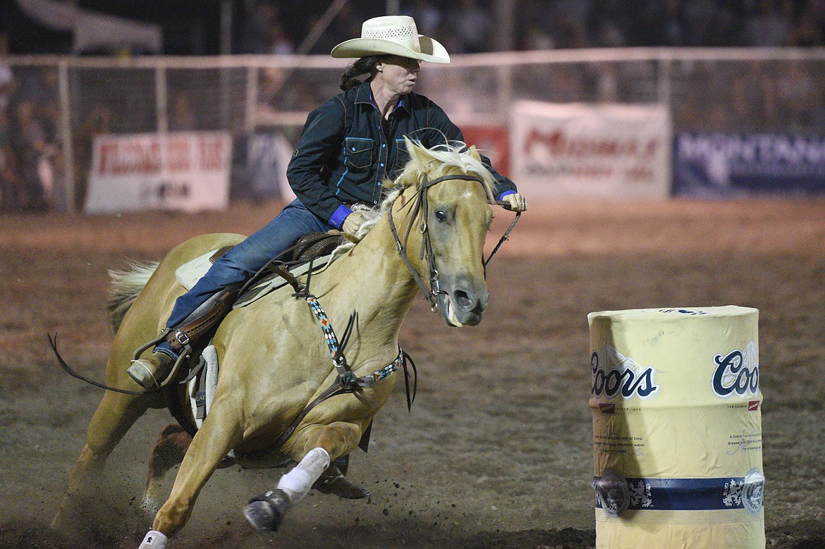 Traci Nowlin, of Nowata, OK, competes in the barrel racing event at the Northwest Montana Fair PRCA Rodeo on Friday evening at the Flathead County Fairgrounds. (Casey Kreider/Daily Inter Lake)