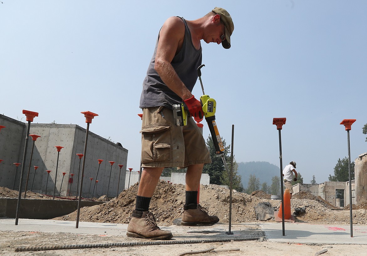 (Photo by ERIC PLUMMER)
Dan Henderson, of Mountain Construction Management, installs some rebar on the new clubhouse this week. It&#146;s been nearly 10 years since the old Idaho Club clubhouse burned down, but construction of a brand new 9,200 square feet structure began recently and is slated to be complete next summer.