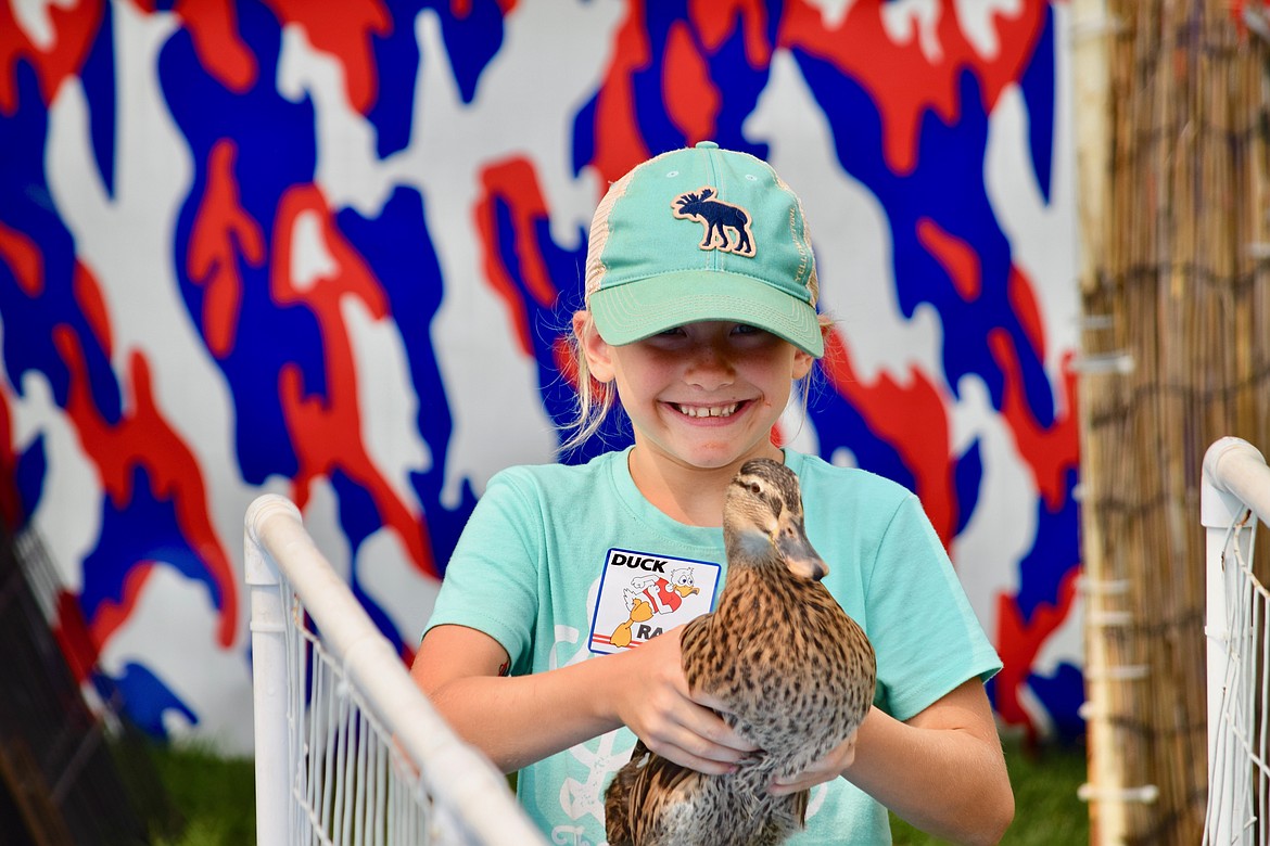 Charles H. Featherstone/Columbia Basin Herald
A girl gets ready to a race a duck during the Grant County Fair.