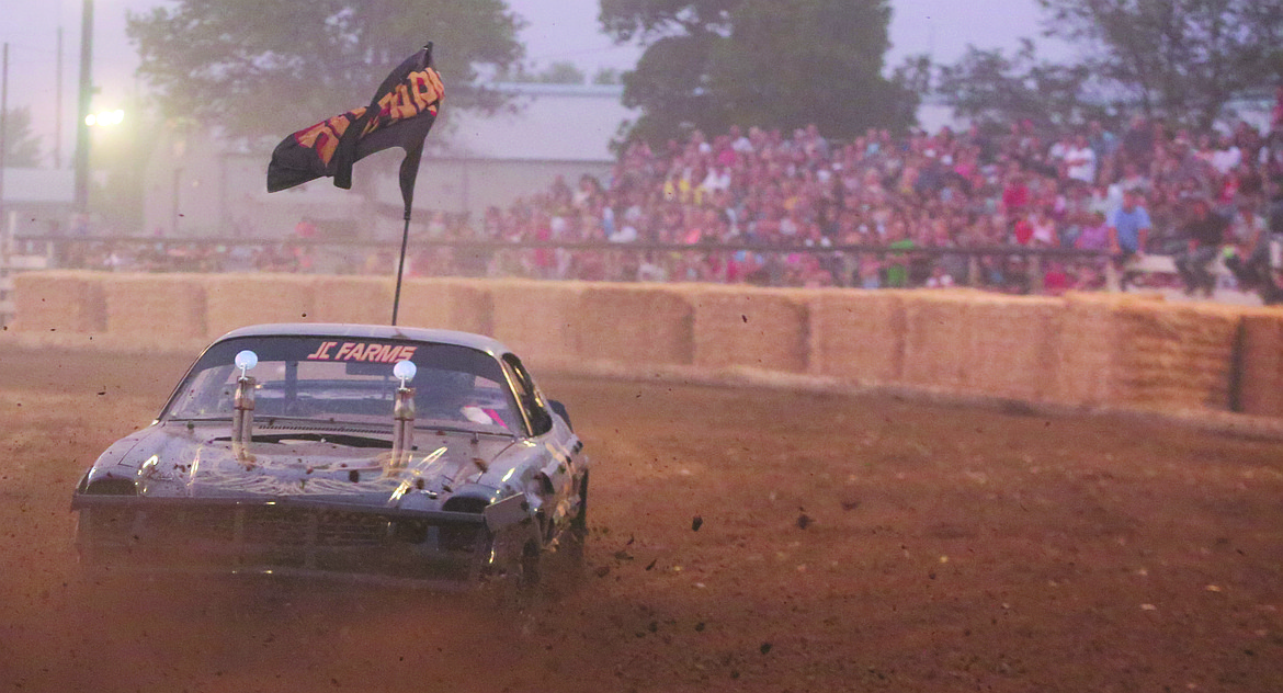 Connor Vanderweyst/Columbia Basin Herald
A racer is spun around and drives in reverse during the Moses Lake Roundup demolition derby.