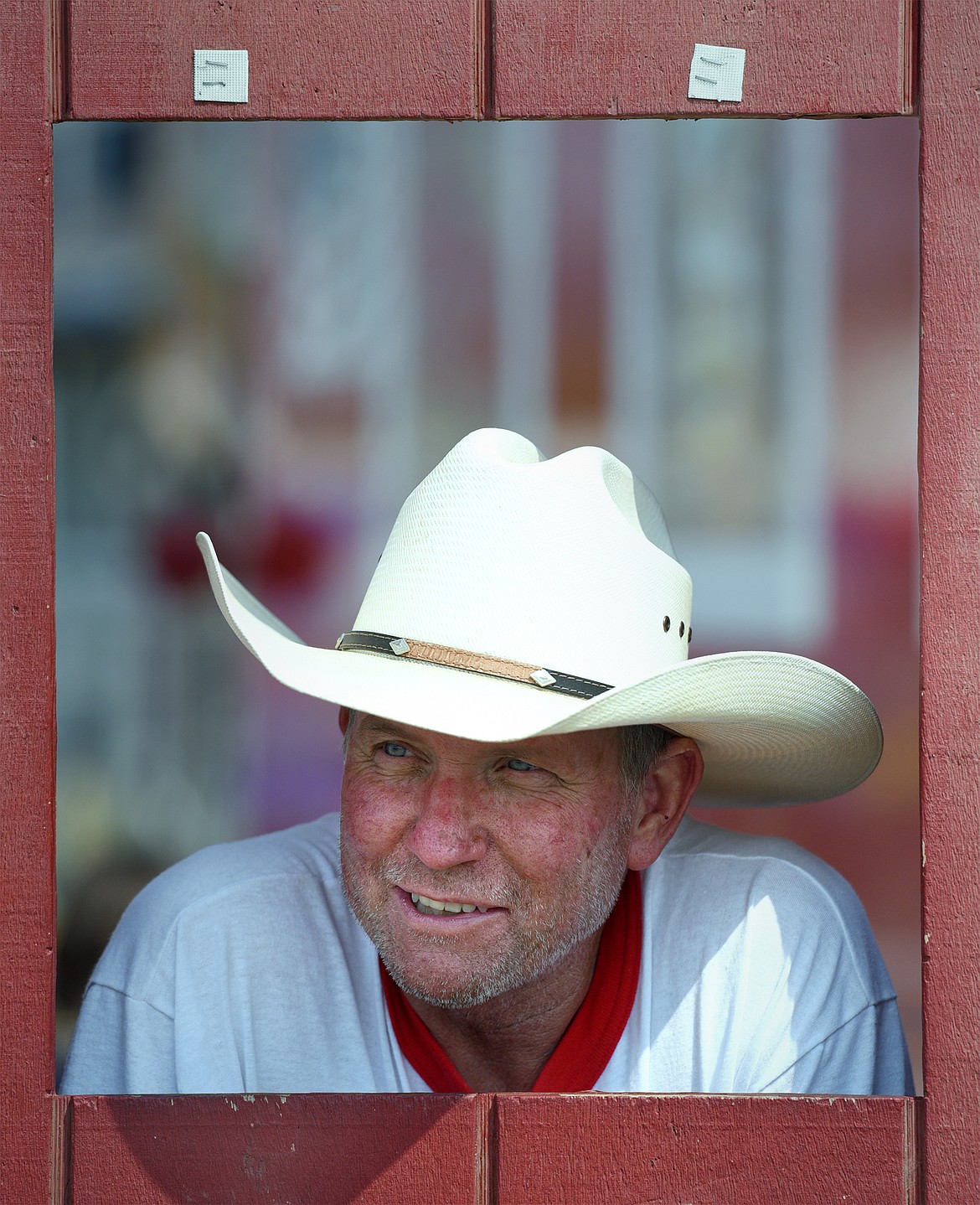 Charlie Cook of Cook&#146;s Racing Pigs stands at a ticket window during the Northwest Montana Fair and Rodeo on Wednesday, Aug. 15. Based out of Galt, California Cook started the pig races during the late &#146;80s. He began taking the show on the road in the &#146;90s. His son Junior helps out. &#147;I showed pigs in 4-H, FFA, my family had a hog ranch,&#148; Cook said. (Casey Kreider/Daily Inter Lake)