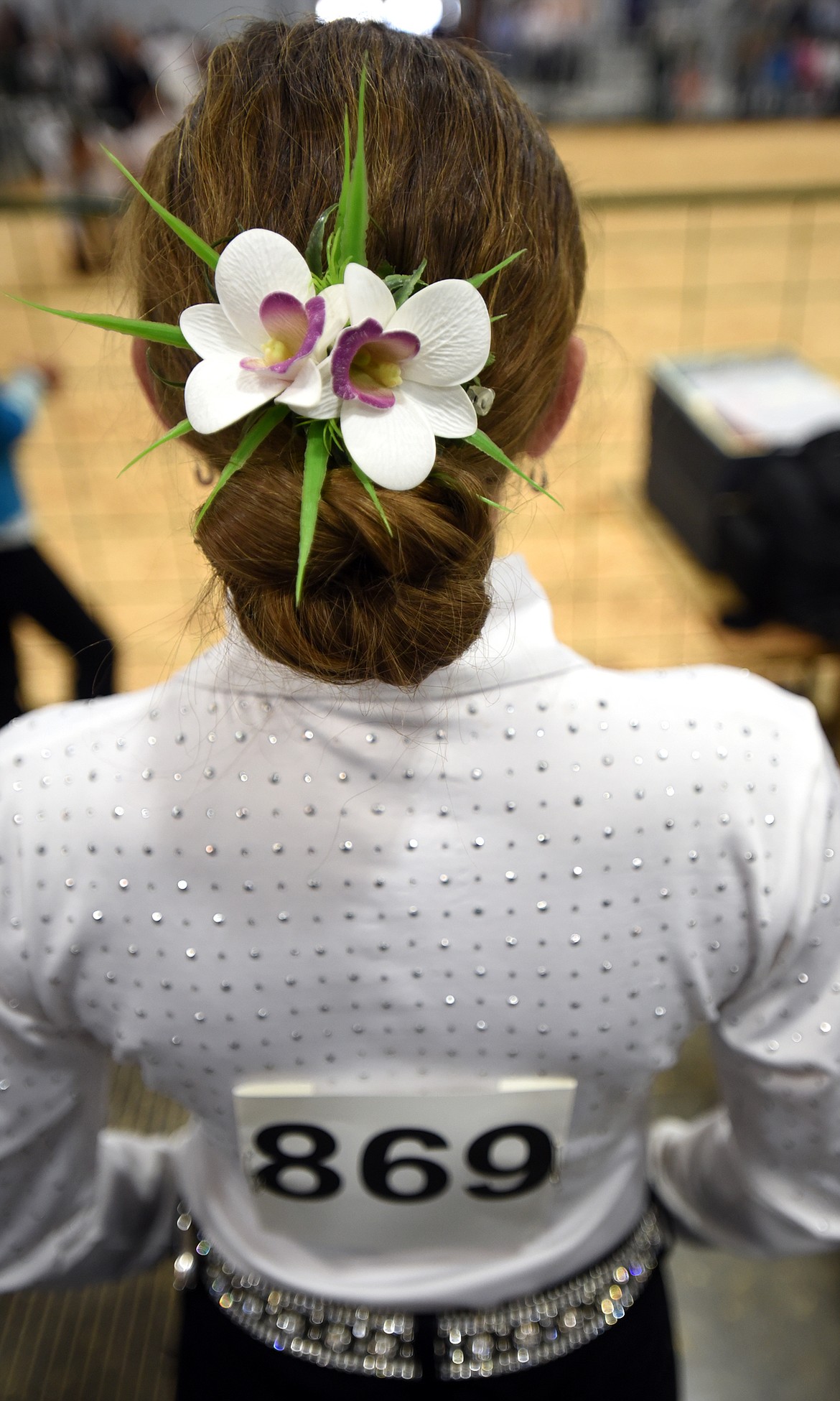 Faith Cheff, 15, of Kalispell, all dressed up and ready to compete watches the senior showmanship competition on Tuesday morning, August 14, as she waits for her turn at the Northwest Montana Fair at the Flathead County fairgrounds in Kalispell.(Brenda Ahearn/Daily Inter Lake)