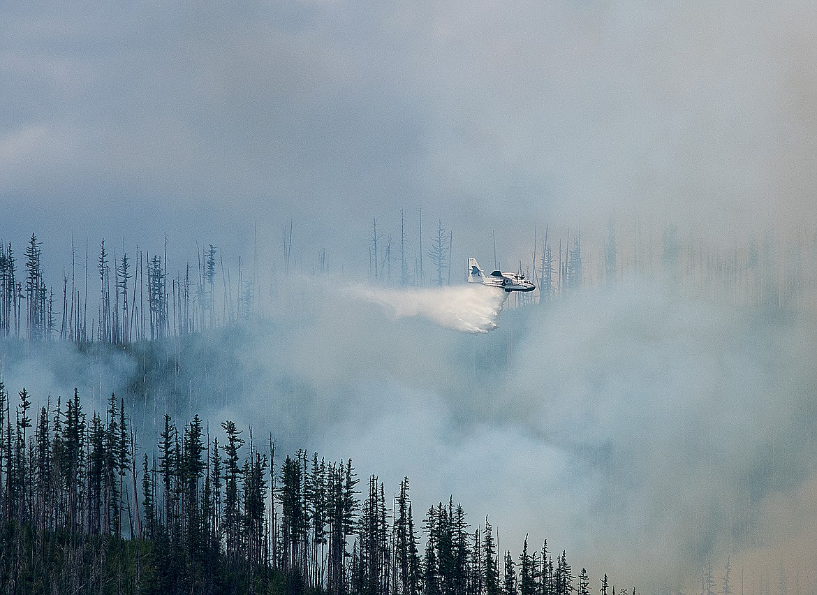 The super scooper drops water on the Howe Ridge Fire Sunday afternoon (Chris Peterson photo)