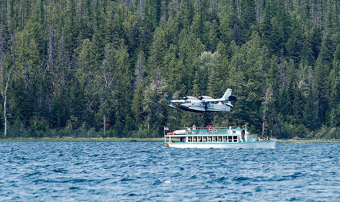 A super scooper flies past the DeSmet tour boat.