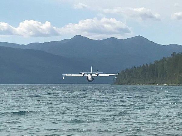 A Canadian super scooper scoops water from Lake McDonald to dump on wildfires burning in Glacier National Park on Sunday. (Karen Cox photo via NPS)