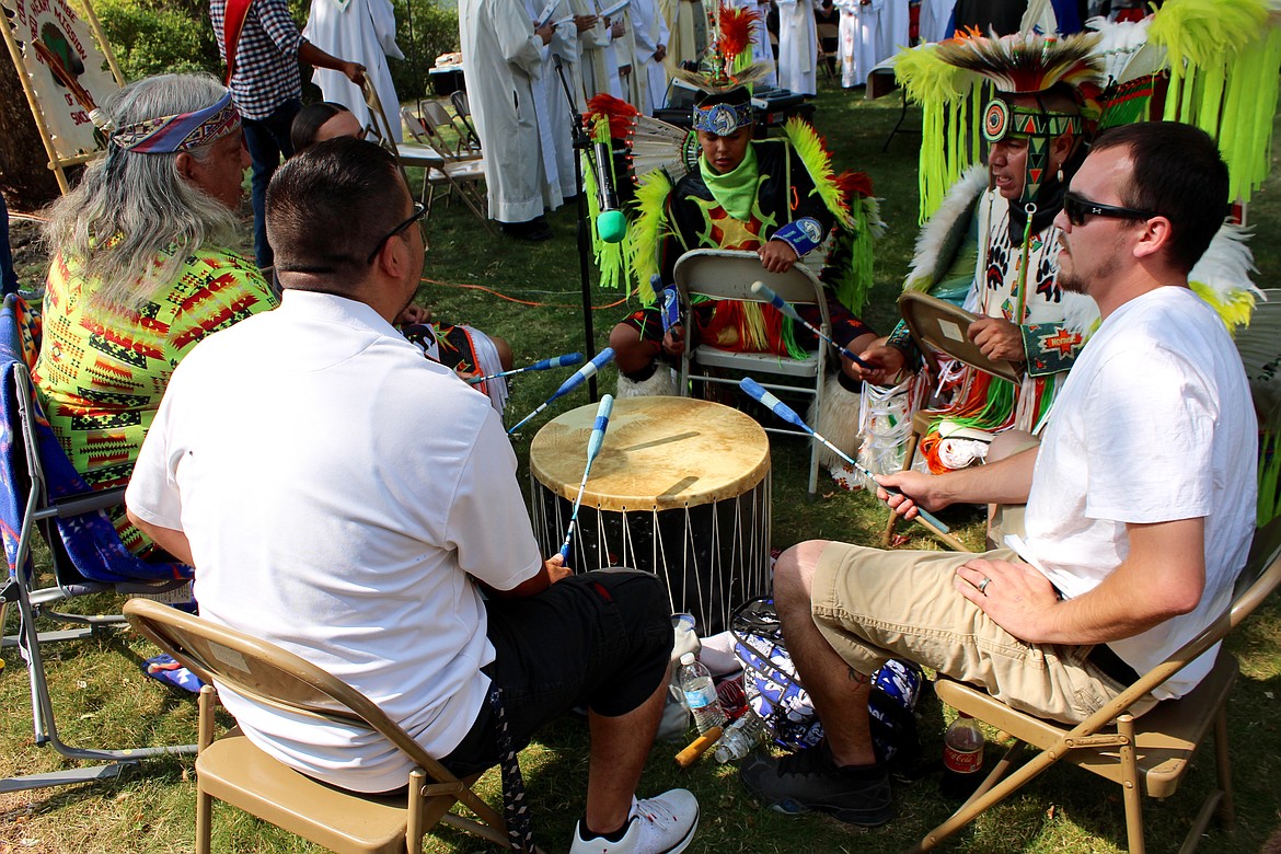 From left clockwise: Calvin Nomee, Tsones Nomee, Butch Nomee, Joseph Nomee and Cheffrey Sailto chant and play a drum to signal the start of Mass.