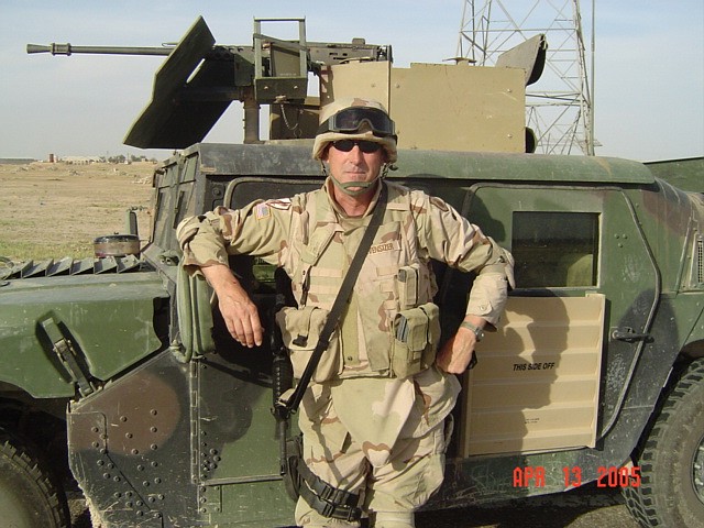 Evensizer is pictured in Iraq leaning against a HUMVEE with mounted M2 .50 cal. machine gun.