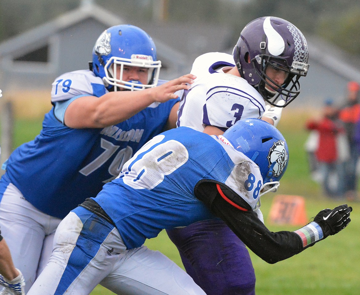 CHARLO HIGH School standout Landers Smith breaks several Mission High School tackles during the regular season game against Mission at Mission HIgh School. Smith, is one of the most decorated football players in Class C 8-man, and is being looked at by several regional colleges to continue his football playing career. (Jason Blasco/Lake County Leader)