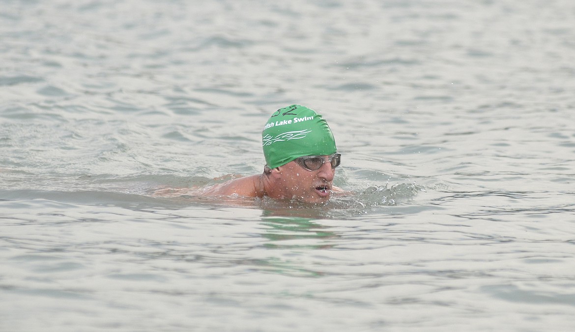 Paul Walker nears the shore of Whitefish Lake as he finishes the 1-mile swim of the Whitefish Lake Swim. (Heidi Desch/Whitefish Pilot)