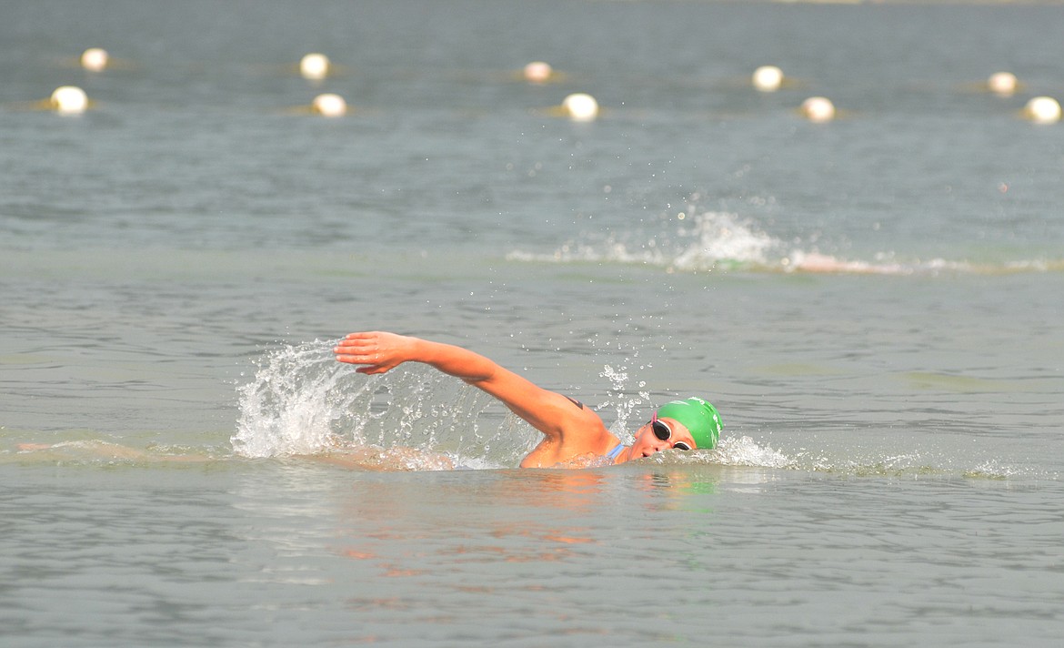 A swimmer competes in the Whitefish Lake swim.