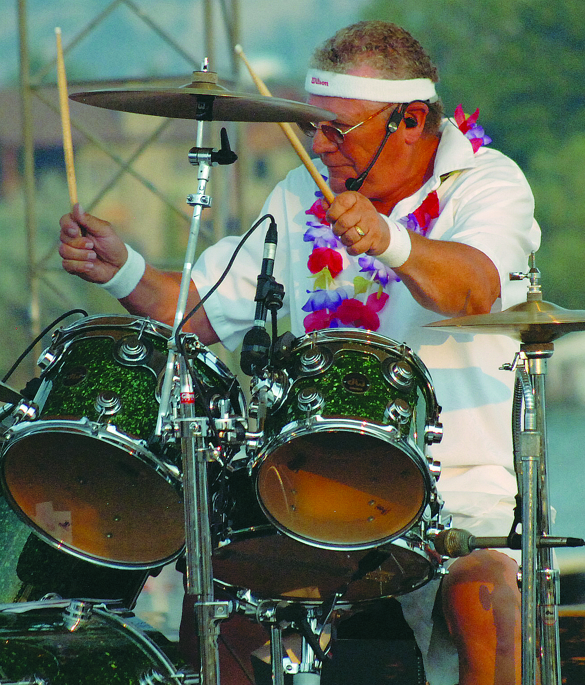 Bop-A-Dips lead vocalist Greg Carter belts out a Beach Boys tune while Doug Smith drums in the background during the Summerfest concert last Saturday night, Aug. 11 at the Regatta Shoreline Amphitheater. (Joe Sova photos/Lake County Leader)