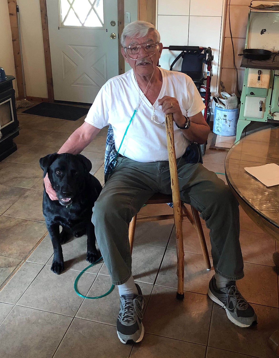 Photo by Josh McDonald
Richard Gutierrez now, sitting at his home with his dog, Tucker. Tucker can tell when Richard&#146;s oxygen levels are low and will alert his wife despite never receiving any training to do so.
