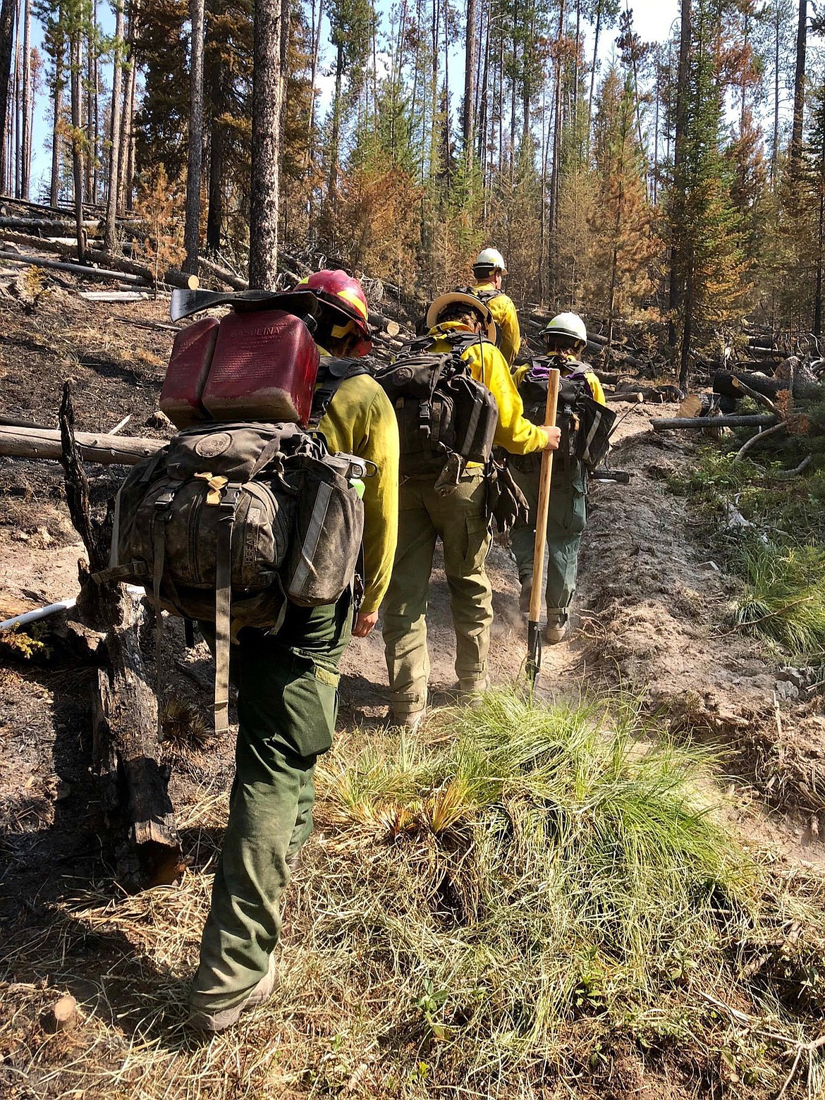 A U.S. Forest Service crew from Eureka hikes to the fireline of the Porcupine fire earlier this week. (Courtesy U.S. Forest Service/Kootenai National Forest)