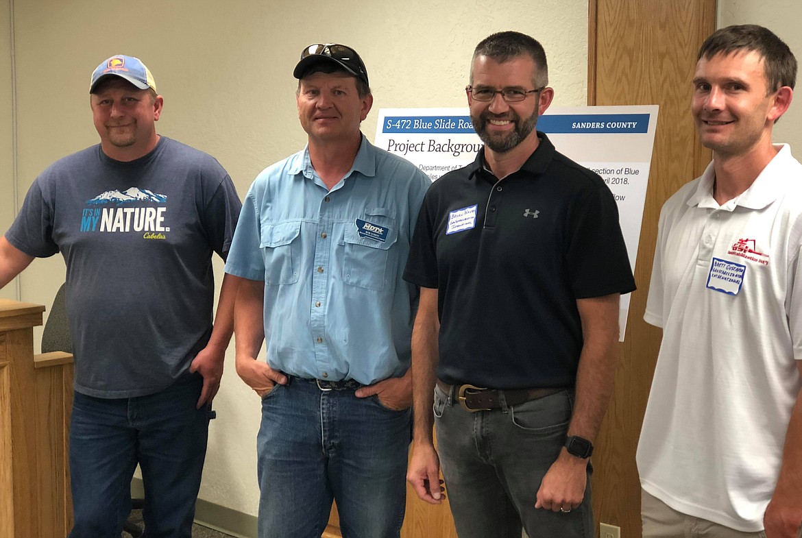 From left to right, Drew Fetters, Bob Vosen, Brian Wayra and Brett Gustafson were all smiles ready to speak to locals about the upcoming Blue Slide Road construction. (Erin Jusseaume/ Clark Fork Valley Press)