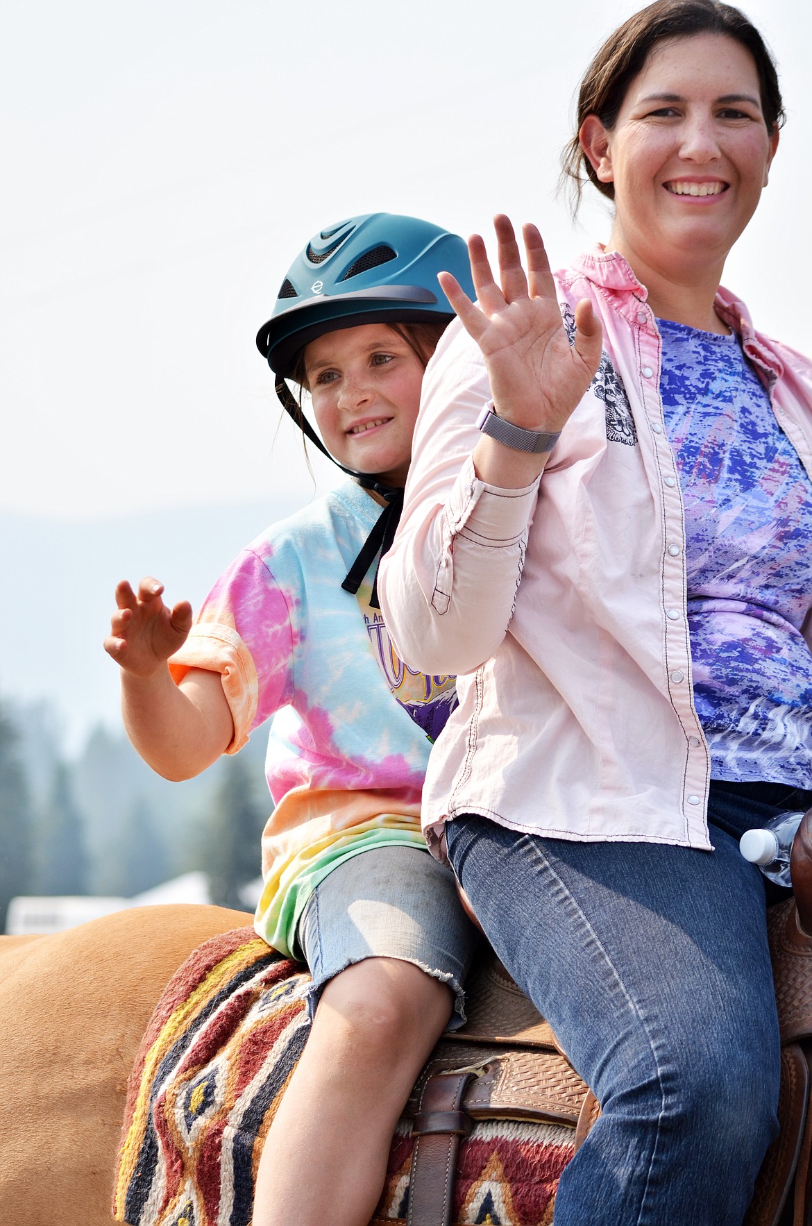 Safety first as these riders double banked through the Huckleberry Parade. (Erin Jusseaume/ Clark Fork Valley Press)