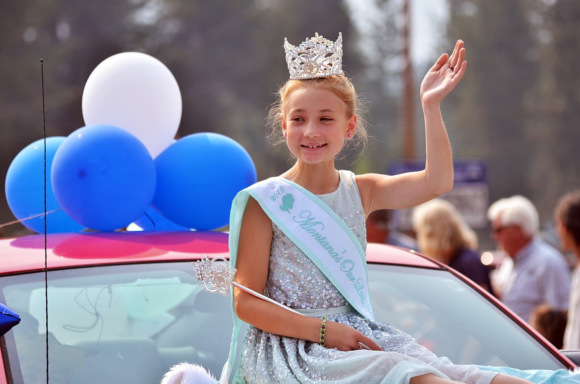 Little Miss Montana Preteen Lola Louise Schock was all smiles as she waved to the crowd (Erin Jusseaume/ Clark Fork Valley Press)