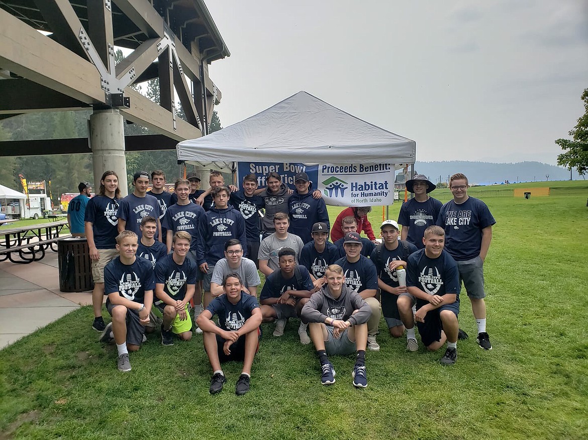 Courtesy photo
Members of the Lake City football team spent their day volunteering at the Habitat for Humanity fundraising event at McEuen Park last Saturday. They made snow cones, played catch, made popcorn and ran bounce houses as a way to give back to their community.