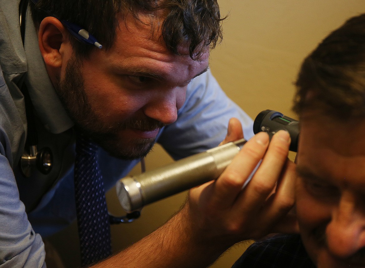 LOREN BENOIT/NIBJ
Dr. James Bailey gives a patient an exam at Artisan Primary Care in Post Falls. Bailey, a direct primary care physician, treats a broad range of conditions, including, but not limited to general illness, injuries, high blood pressure, diabetes and mental health.