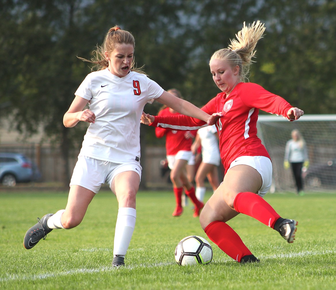 (Photo by ERIC PLUMMER)
Senior Kayla Inman, right, earned an assist on the first goal of the game.