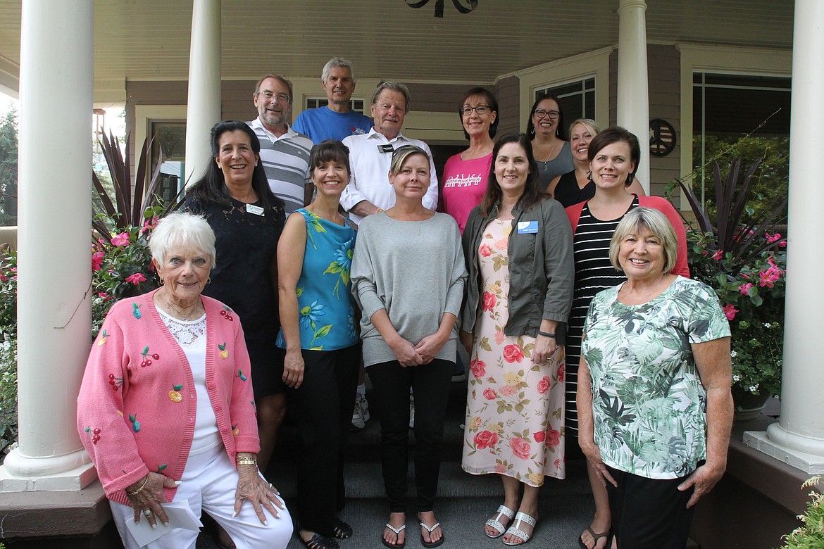 The Coeur d'Alene Garden Club distributed $15,000 among 10 local causes and nonprofits during a presentation ceremony Thursday at the downtown Coeur d'Alene home of Susan and Will Beglinger. The funds were raised during the club's garden tour, held annually in July. Left to right, front row: Coeur d'Alene Garden Club Garden Tour chair Bonnie Warwick and club president Cathy Evjen. Second row, left to right: Liz Beck, Children's Village; Rayelle Anderson, North Idaho College Foundation; Melanie Krier and Katie Simmons, ICARE (St. Vincent de Paul); and Kristine Miller, Safe Passage Violence Prevention Center. Third row, left to right: Vern Harvey, Hayden Meadows Elementary greenhouse project; John Corcoran, ElderHelp of North Idaho; Vicky Nelson, Kootenai Humane Society; Kim Normand, Shared Harvest Community Garden; and Jessica Mannon, the Gathering Garden at NIC. Back row: James Fillmore, Turkeys and More. (DEVIN WEEKS/Press)