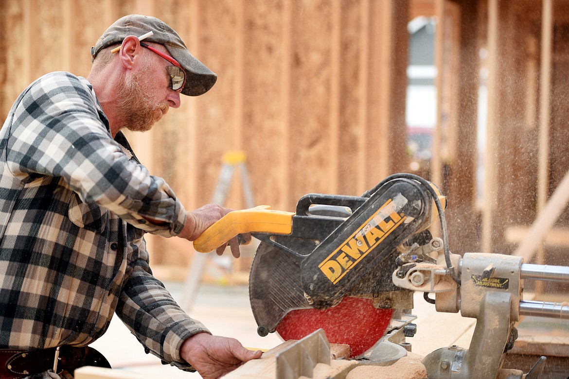 Gary Hawkins of Iron Star Construction works on a house on Ali Loop.