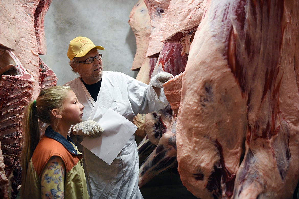 Ron Vandevanter, of Vandevanter Meats, judges the beef from Ione Plummer&#146;s steer at Vandevanter Meats in Columbia Falls on Wednesday, Aug. 22. (Casey Kreider/Daily Inter Lake)