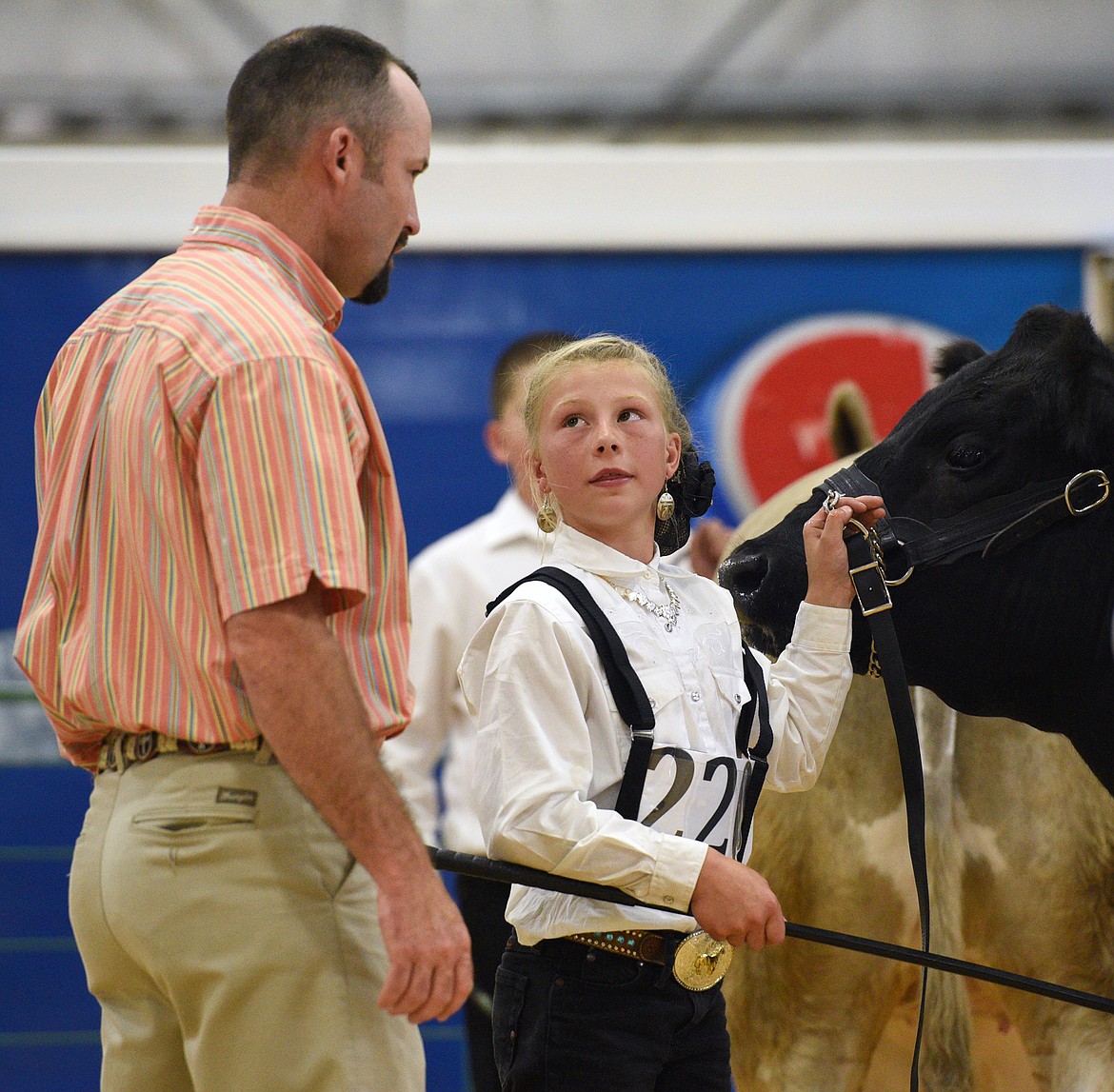 Ione Plummer, 10, speaks with livestock judge Josh Stroh during the beef showmanship and market judging at the Northwest Montana Fair on Tuesday, Aug. 14. (Casey Kreider/Daily Inter Lake)