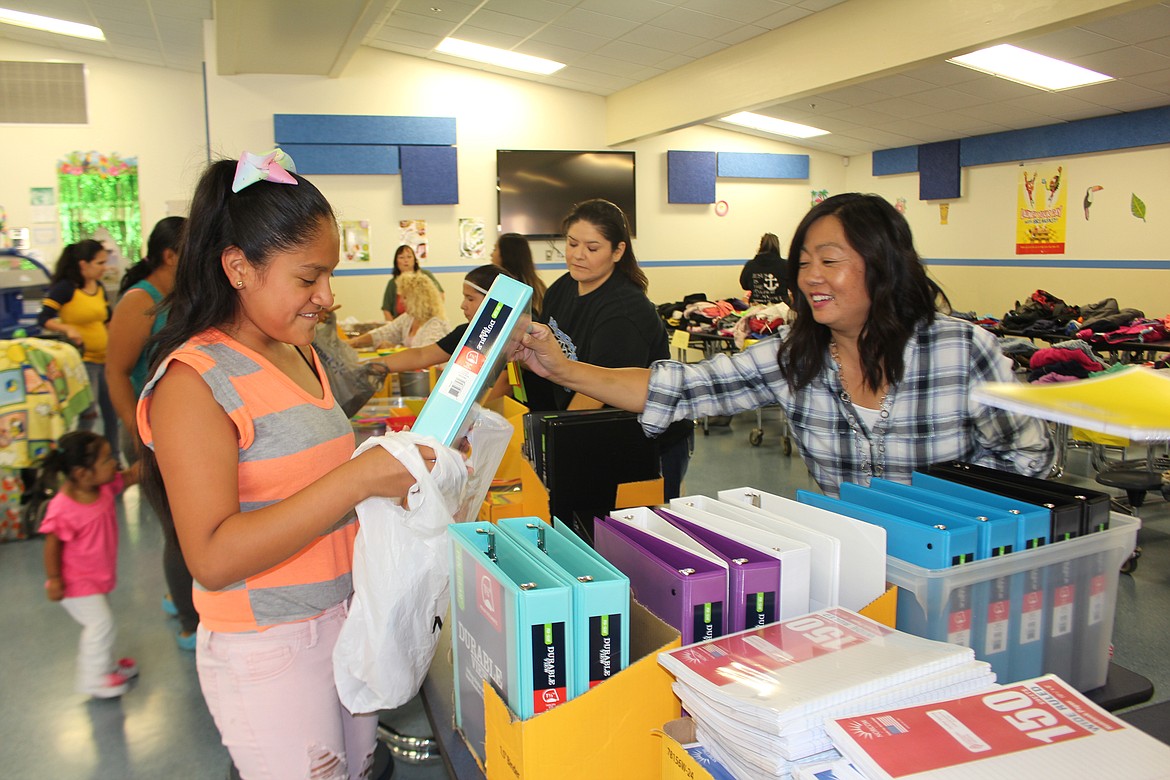 Cheryl Schweizer/Columbia Basin Herald

School supplies, haircuts, popcorn, hot dogs, and a welcome back to school were part of the first 'Back to School' distribution in Warden Friday.