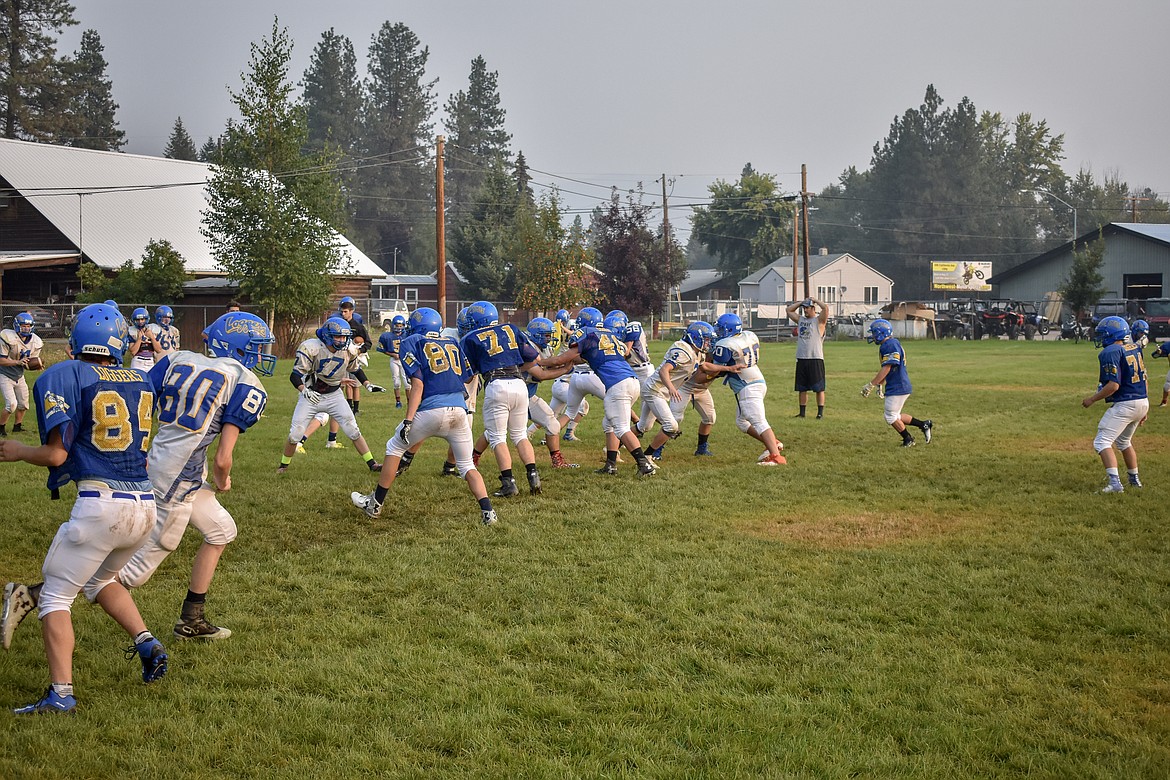The Libby High School football team practices Friday, Aug. 17. (Ben Kibbey/The Western News)