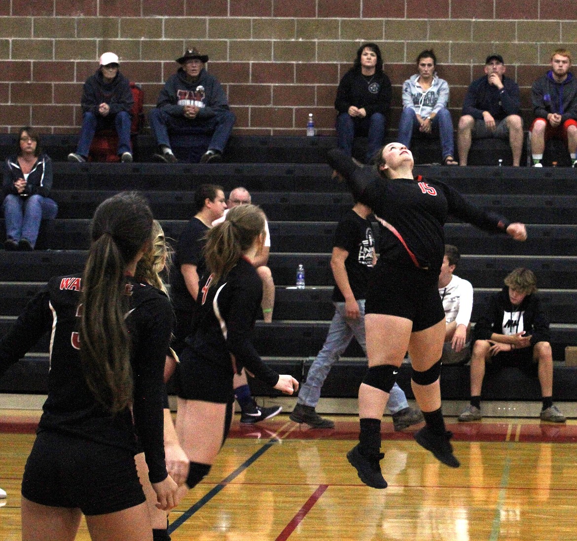 Maggie Howard sets up for a big spike during the opening set of the Miners' match on Tuesday.