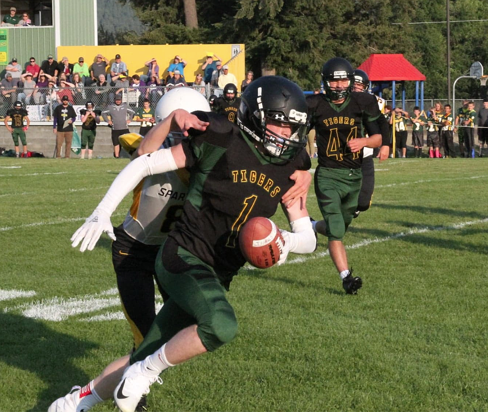 Courtesy photo/
Mullan&#146;s Chandler Holling (green uniform) hauls in a reception during Mullan&#146;s massive win over Timberline.