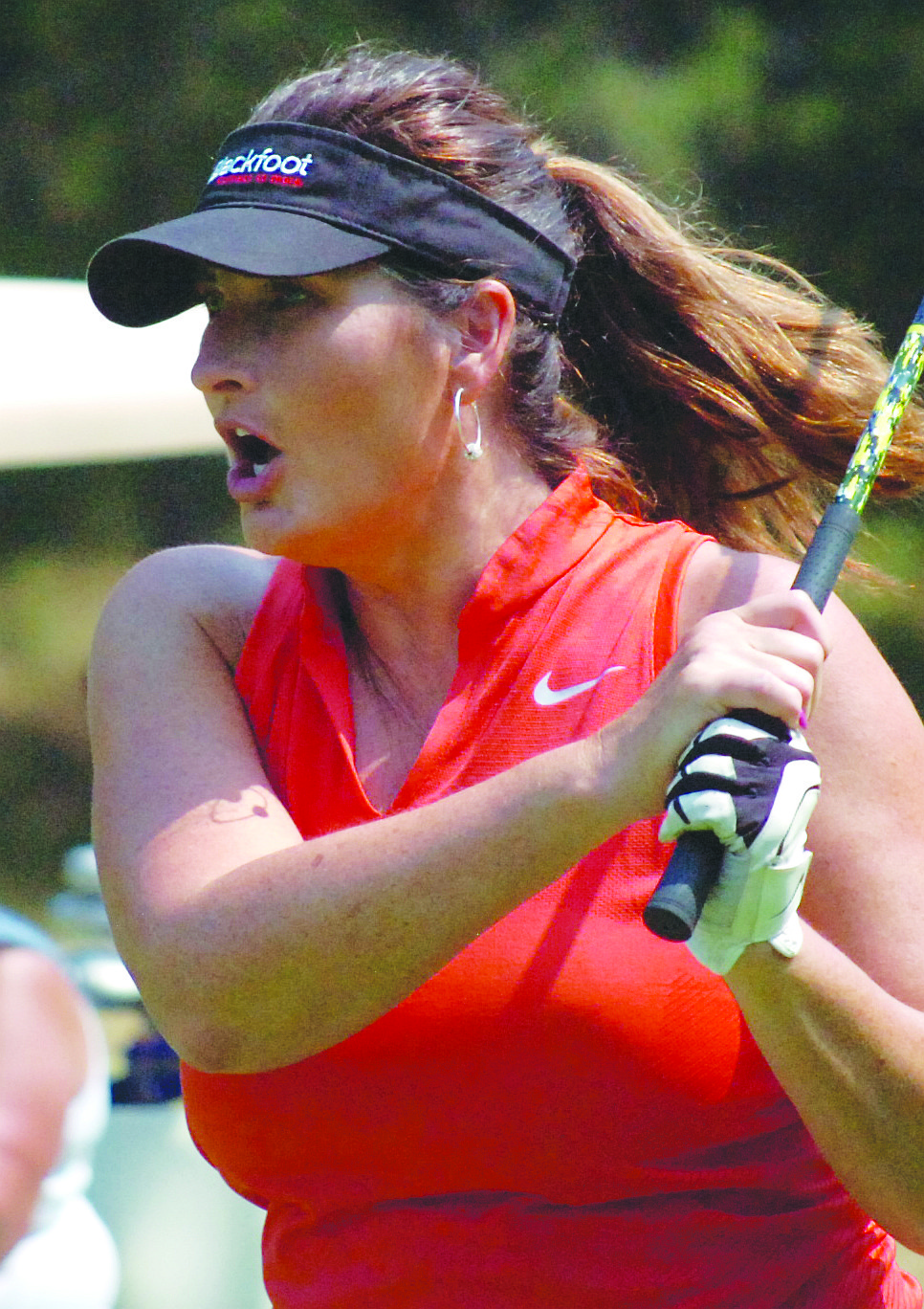 Bridget Kennedy of the Blackfoot Communications team reacts to her fairway shot during Avista&#146;s 10th Annual Charity Golf Scramble and Silent Auction.