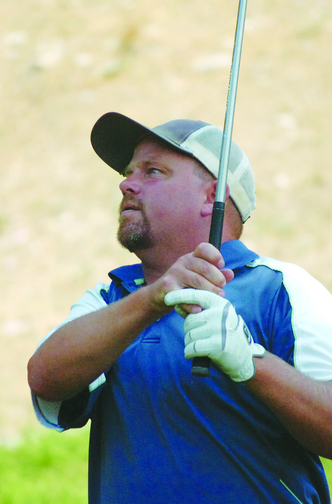 Jason Oyler watches his tee shot head down the fairway during Avista&#146;s 10th Annual Charity Golf Scramble and Silent Auction.