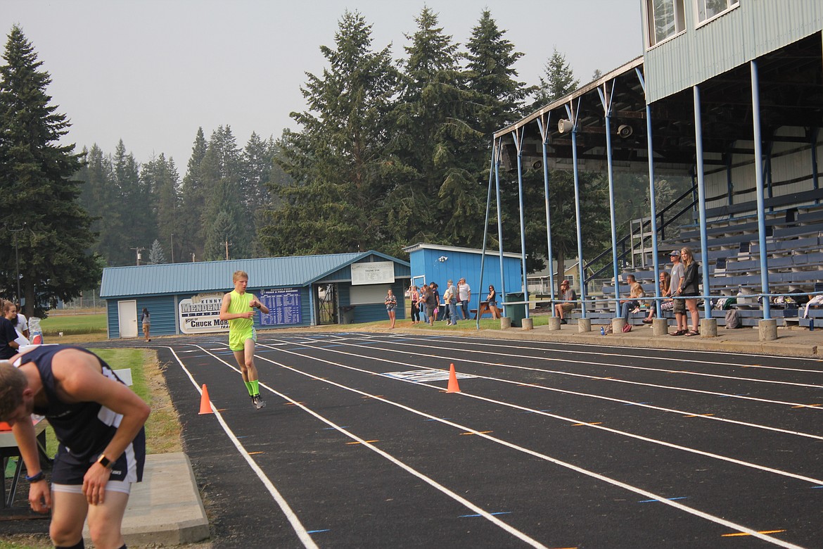 Sam Gorton, above, and Hunter Smith cross the finish line in good time.