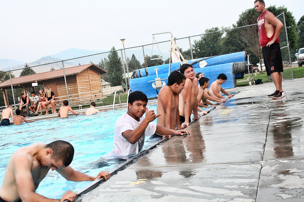 Horsemen Head Coach Eddie Fultz, watches on as his team works on resistance training in the pool after practice on the field (Photo/Jessica Peterson)