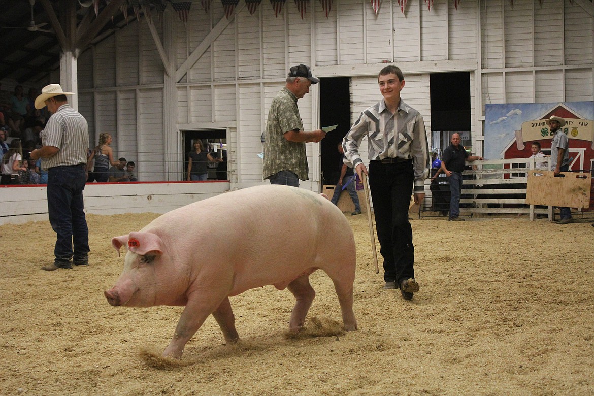 Photo by TANNA YEOUMANS
Each pig gave their handlers a little grief going around the arena.