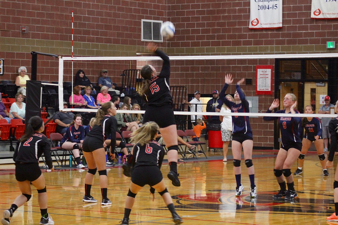 Photos by CHANSE WATSON/
Senior Maggie Howard spikes the ball in Thursday’s game against Cd’A Charter Academy.