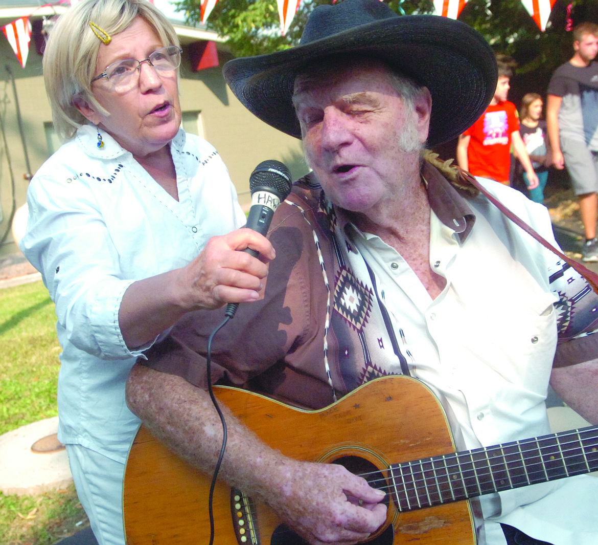 Keath and Connie Shanklin of Thompson Falls sing a duet during the Plains Library 100th anniversary celebration on Saturday. (Joe Sova photos/Clark Fork Valley Press)