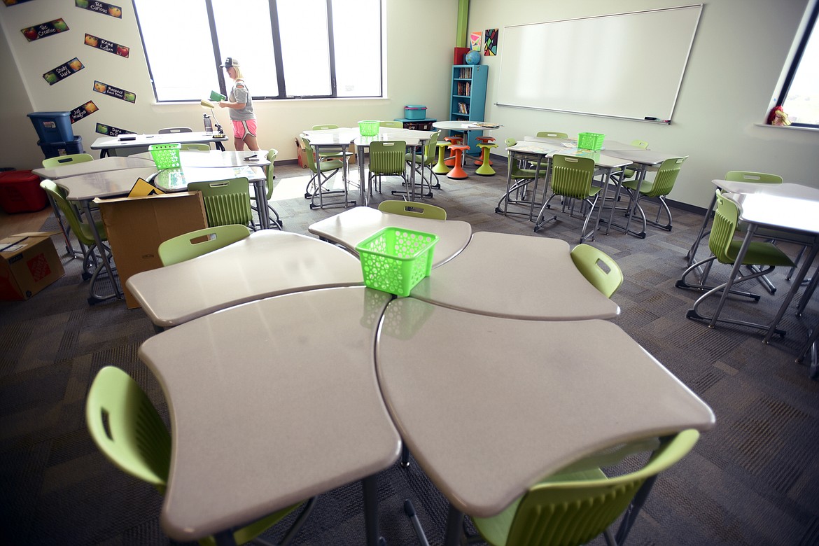 Kari Peiffer prepares her fifth-grade classroom for new students on Tuesday, Aug. 21, at Rankin Elementary in south Kalispell. (Brenda Ahearn/Daily Inter Lake)